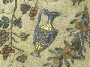 Amphora surrounded by grape vines